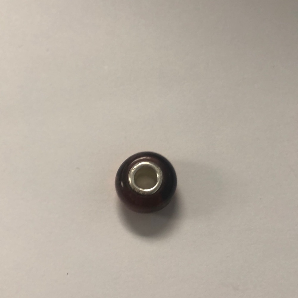 Pandora maroon colored  glass charm